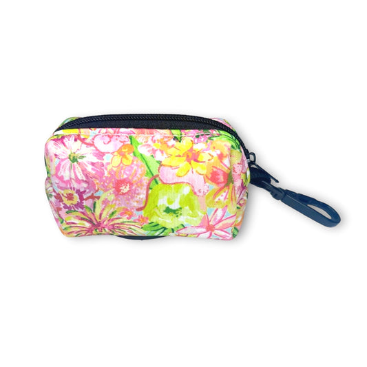 Floral design poop bag holder with black hardware on a white background