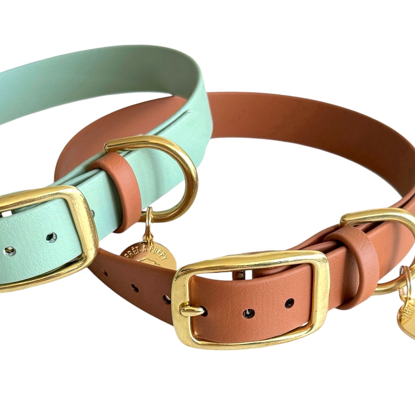 Two dog collars with strap keepers against a white background.