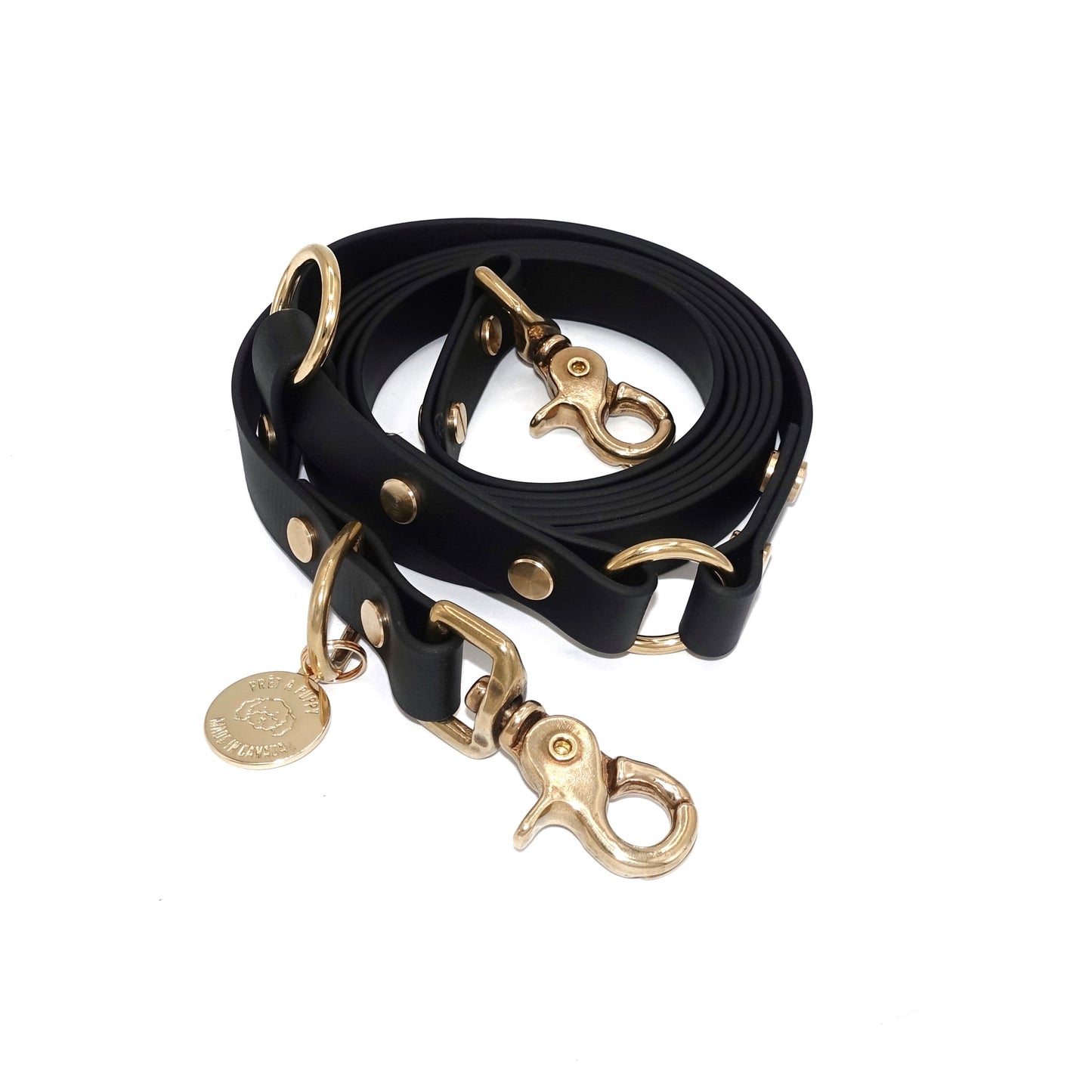 Black Biothane hands-free dog leash with gold hardware, waterproof and versatile for waist or crossbody wear