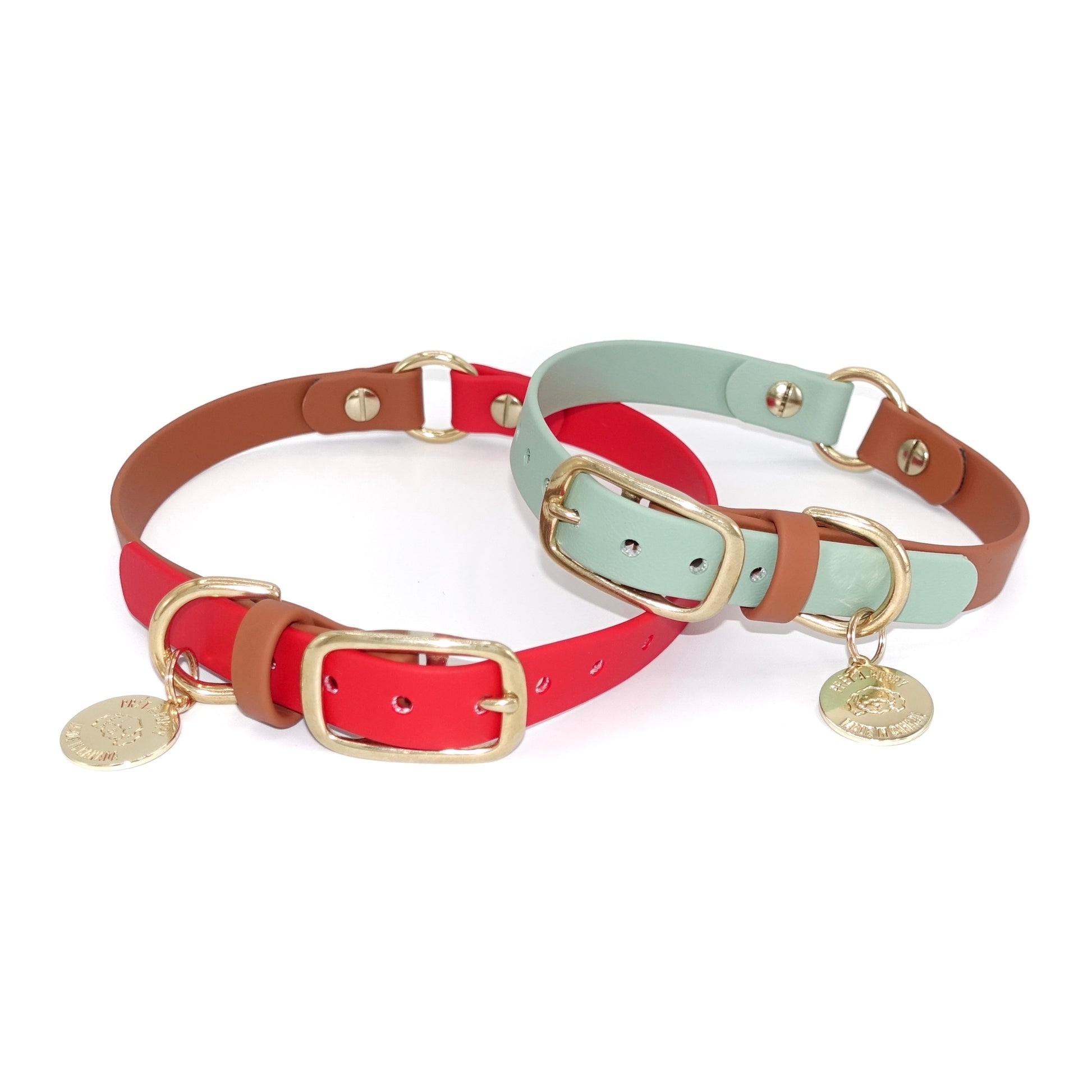 Two dog collars, one red and brown and one green and brown with gold buckles, on a white background.