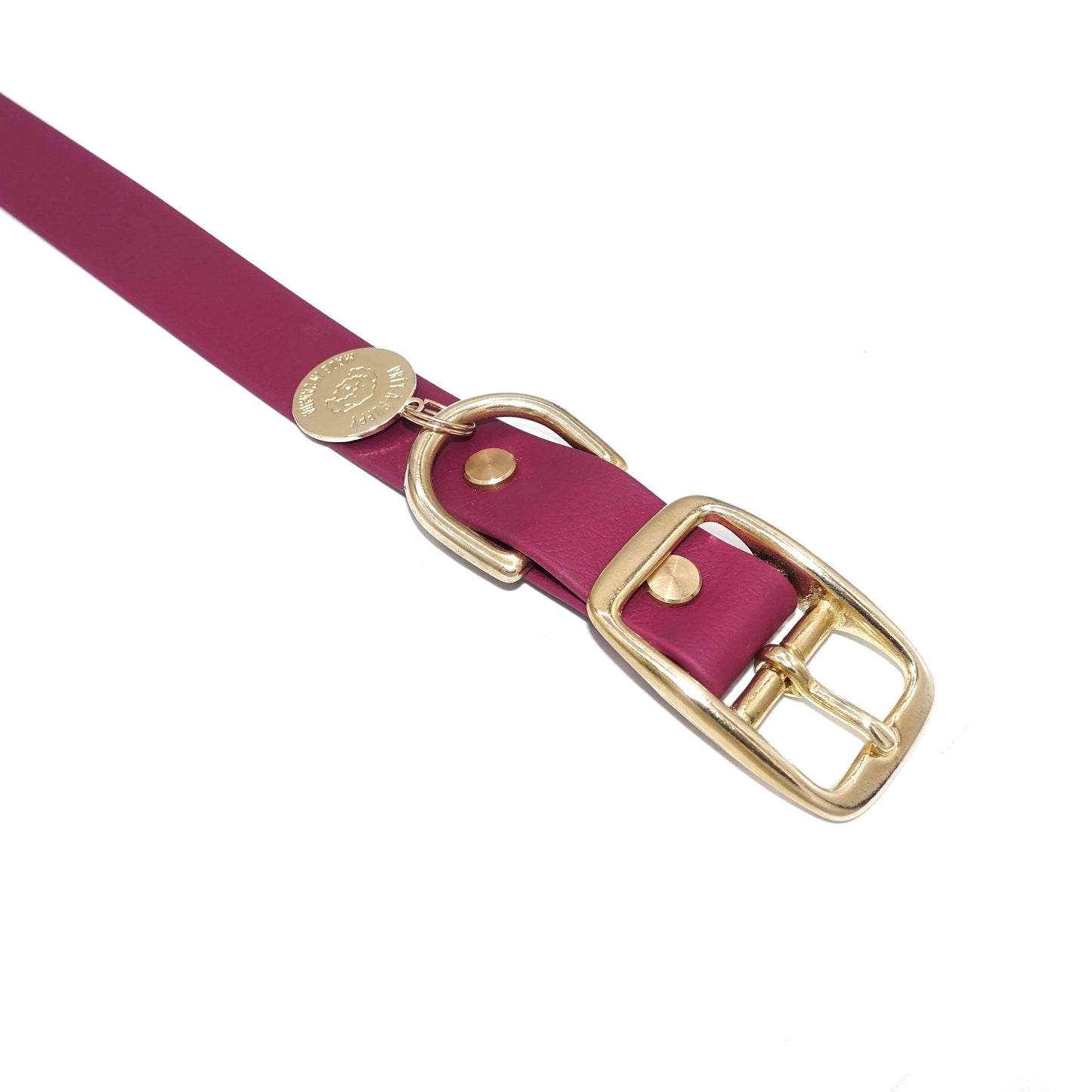 Burgundy dog collar with gold buckle on a white background