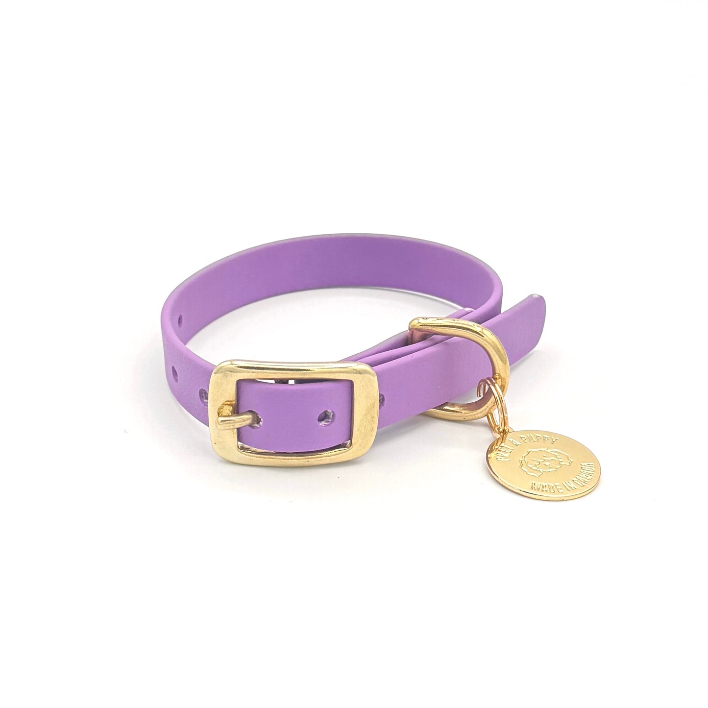 Stylish purple dog collar made from high-quality vegan leather, featuring elegant gold hardware. This waterproof collar is soft to the touch, ensuring comfort for your pet while providing durability for everyday use. Ideal for pet owners looking for a fashionable, and long-lasting accessory for their dog.