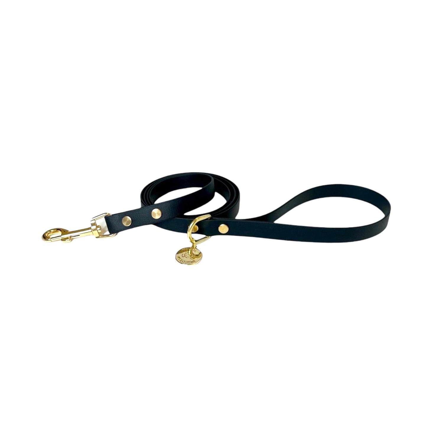 Stylish black dog leash made from high-quality vegan leather, featuring elegant gold hardware. This waterproof leash is soft to the touch, ensuring comfort for pet owners while providing durability for everyday walks. Ideal for pet owners looking for a fashionable, and long-lasting accessory for their dog