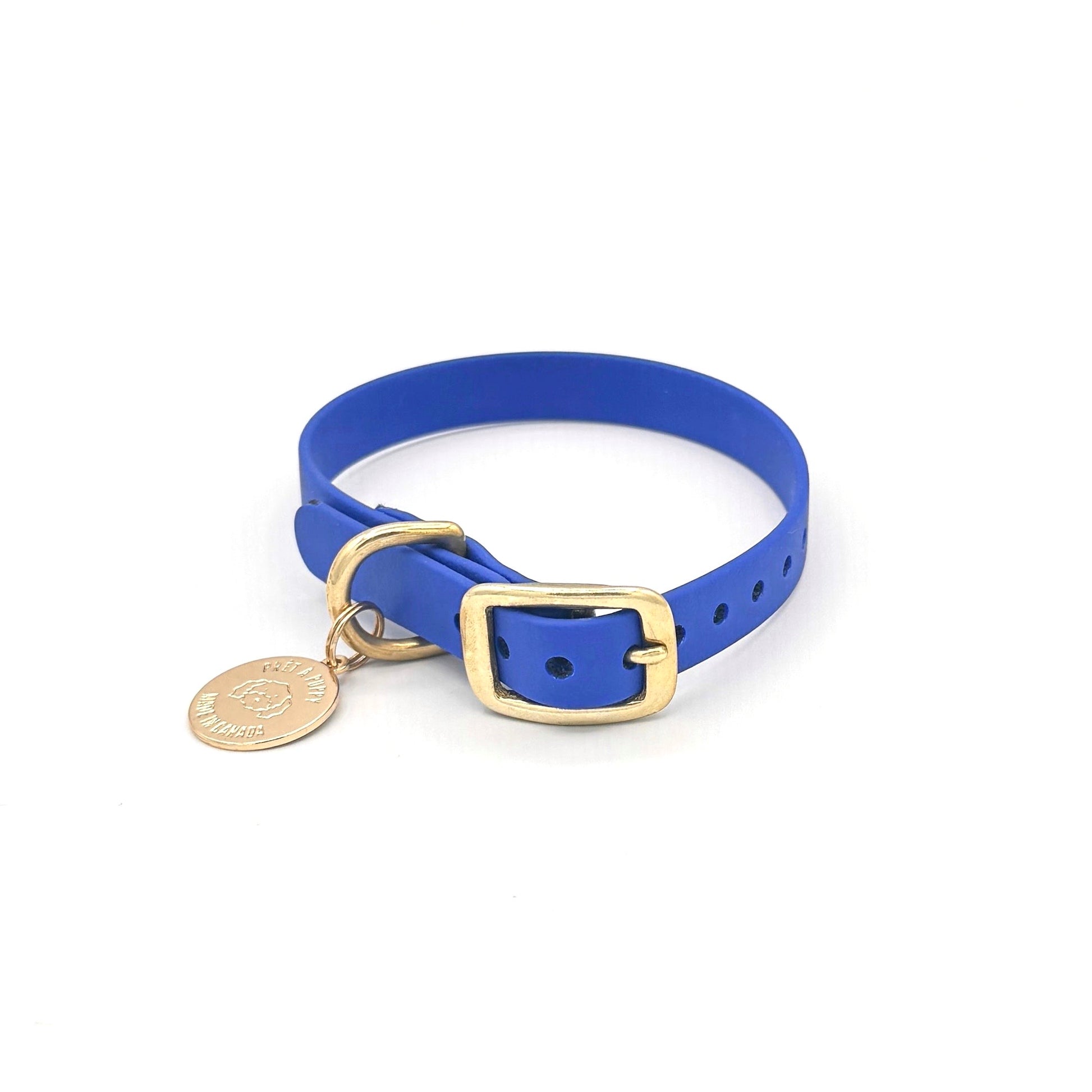 Stylish royal blue dog collar made from high-quality vegan leather, featuring elegant gold hardware. This waterproof collar is soft to the touch, ensuring comfort for your pet while providing durability for everyday use. Ideal for pet owners looking for a fashionable, and long-lasting accessory for their dog.