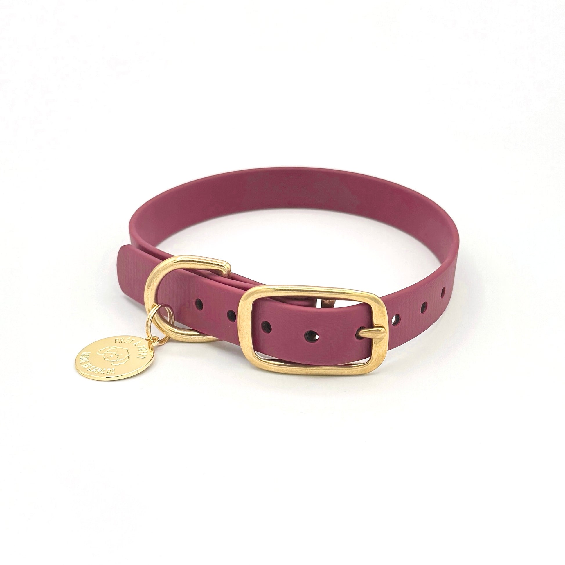 Stylish burgundy dog collar made from high-quality vegan leather, featuring elegant gold hardware. This waterproof collar is soft to the touch, ensuring comfort for your pet while providing durability for everyday use. Ideal for pet owners looking for a fashionable, and long-lasting accessory for their dog.