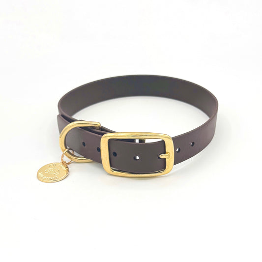 Stylish dark brown dog collar made from high-quality vegan leather, featuring elegant gold hardware. This waterproof collar is soft to the touch, ensuring comfort for your pet while providing durability for everyday use. Ideal for pet owners looking for a fashionable, and long-lasting accessory for their dog.