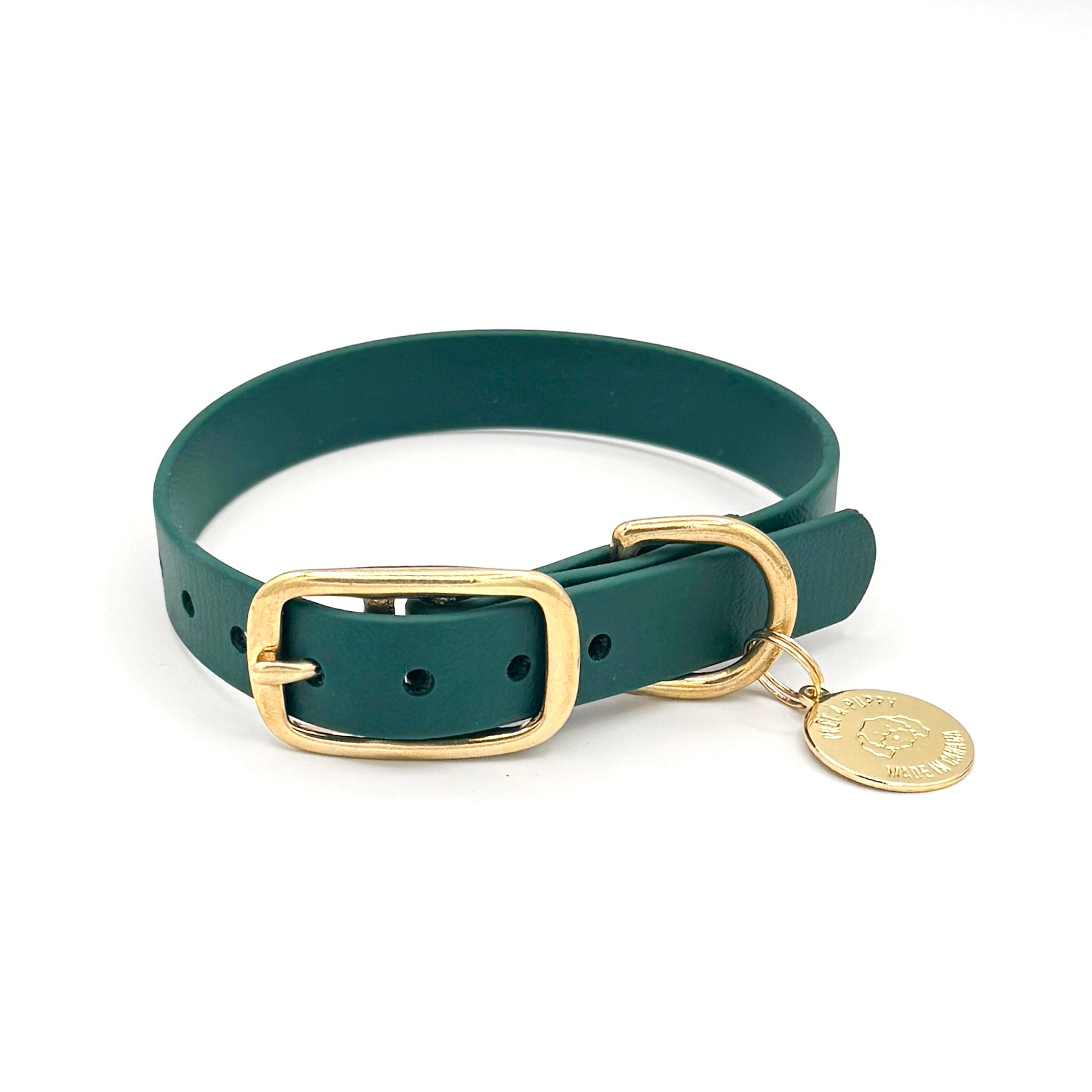 Stylish forest green dog collar made from high-quality vegan leather, featuring elegant gold hardware. This waterproof collar is soft to the touch, ensuring comfort for your pet while providing durability for everyday use. Ideal for pet owners looking for a fashionable, and long-lasting accessory for their dog.