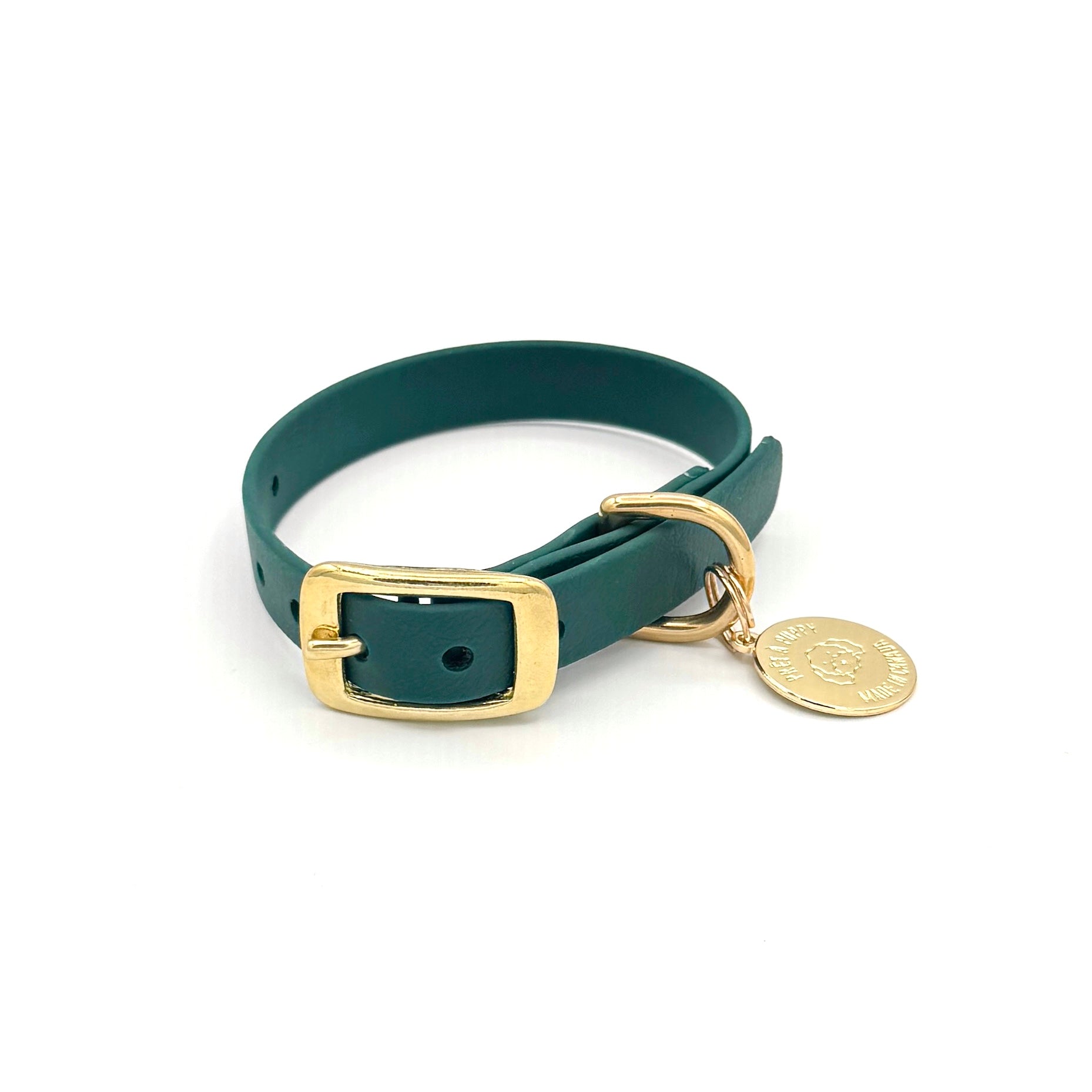 Stylish forest green dog collar made from high-quality vegan leather, featuring elegant gold hardware. This waterproof collar is soft to the touch, ensuring comfort for your pet while providing durability for everyday use. Ideal for pet owners looking for a fashionable, and long-lasting accessory for their dog.