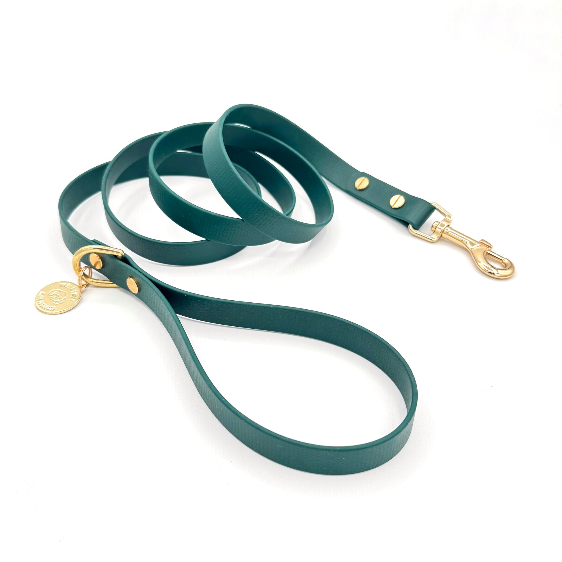 Stylish forest green dog leash made from high-quality vegan leather, featuring elegant gold hardware. This waterproof leash is soft to the touch, ensuring comfort for pet owners while providing durability for everyday walks. Ideal for pet owners looking for a fashionable, and long-lasting accessory for their dog