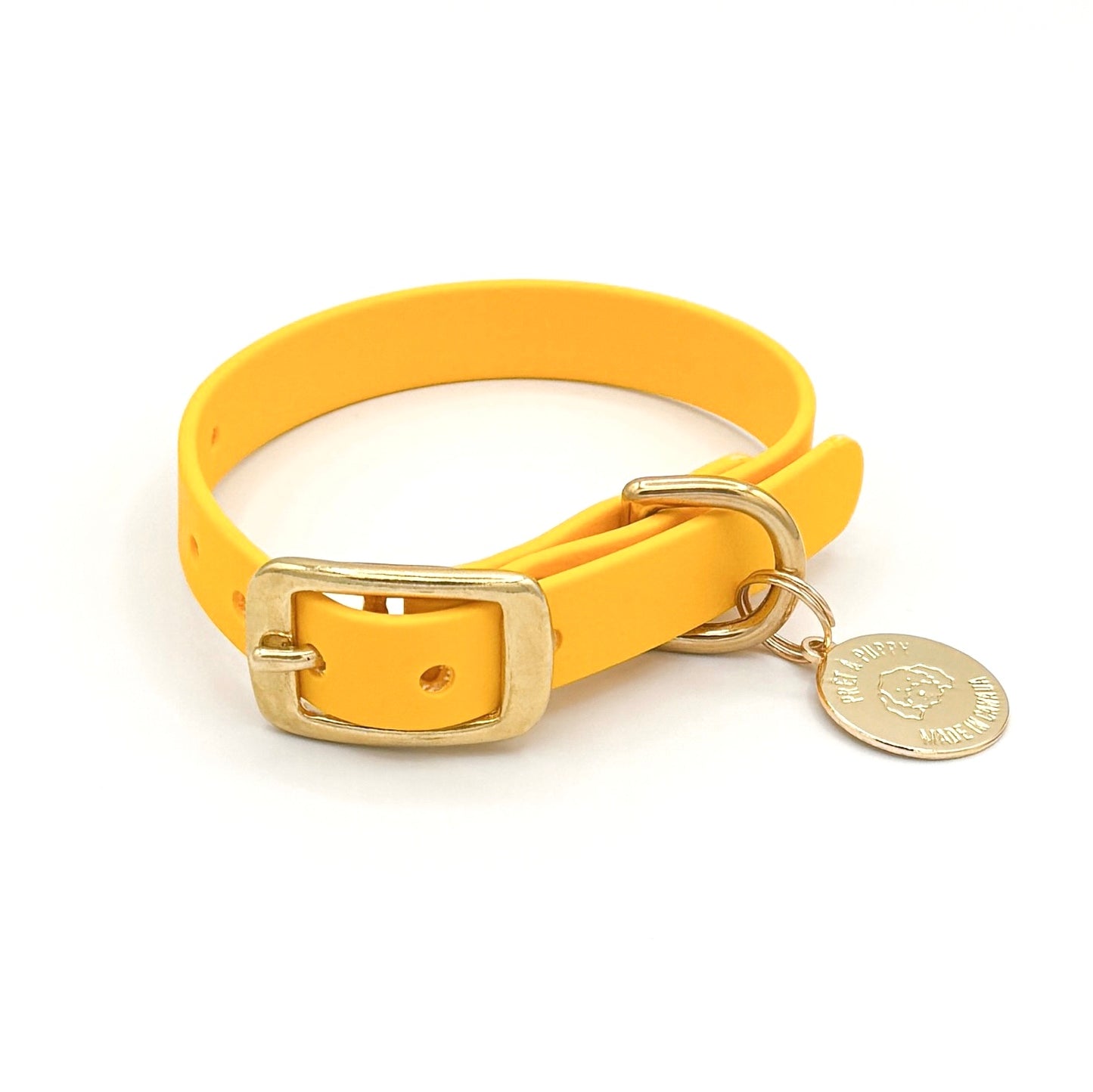 Stylish yellow dog collar made from high-quality vegan leather, featuring elegant gold hardware. This waterproof collar is soft to the touch, ensuring comfort for your pet while providing durability for everyday use. Ideal for pet owners looking for a fashionable, and long-lasting accessory for their dog.