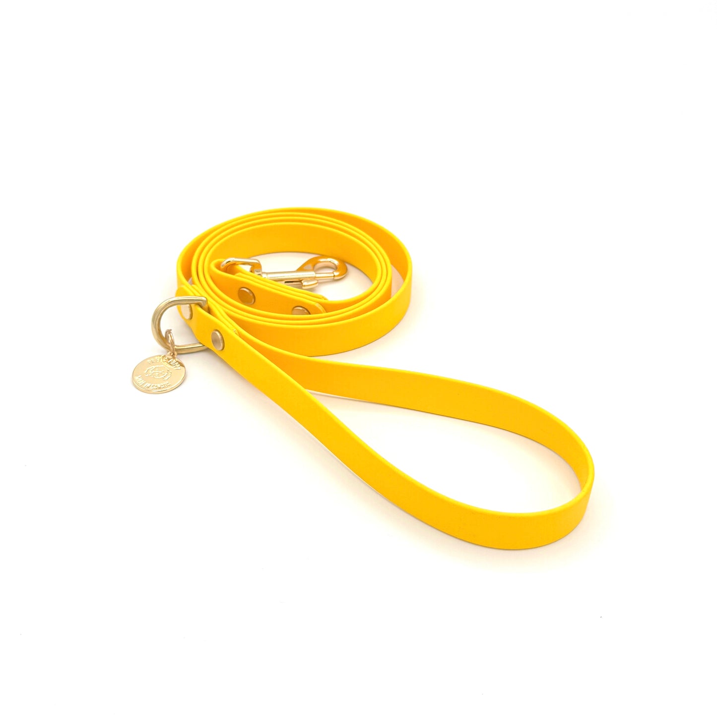 Stylish yellow dog leash made from high-quality vegan leather, featuring elegant gold hardware. This waterproof leash is soft to the touch, ensuring comfort for pet owners while providing durability for everyday walks. Ideal for pet owners looking for a fashionable, and long-lasting accessory for their dog