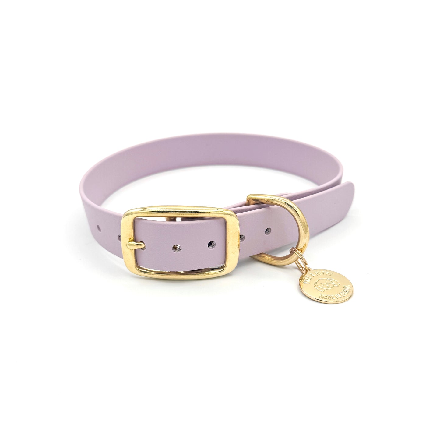 Stylish lilac light purple dog collar made from high-quality vegan leather, featuring elegant gold hardware. This waterproof collar is soft to the touch, ensuring comfort for your pet while providing durability for everyday use. Ideal for pet owners looking for a fashionable, and long-lasting accessory for their dog.