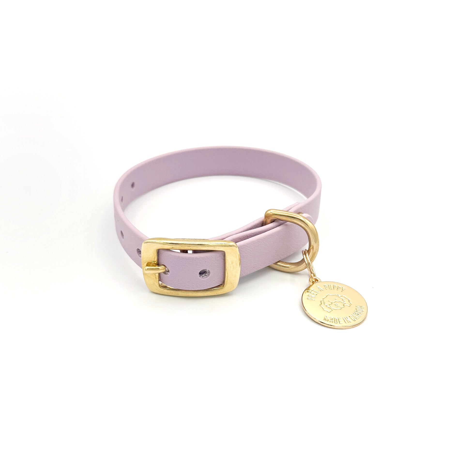 Stylish lilac light purple dog collar made from high-quality vegan leather, featuring elegant gold hardware. This waterproof collar is soft to the touch, ensuring comfort for your pet while providing durability for everyday use. Ideal for pet owners looking for a fashionable, and long-lasting accessory for their dog.