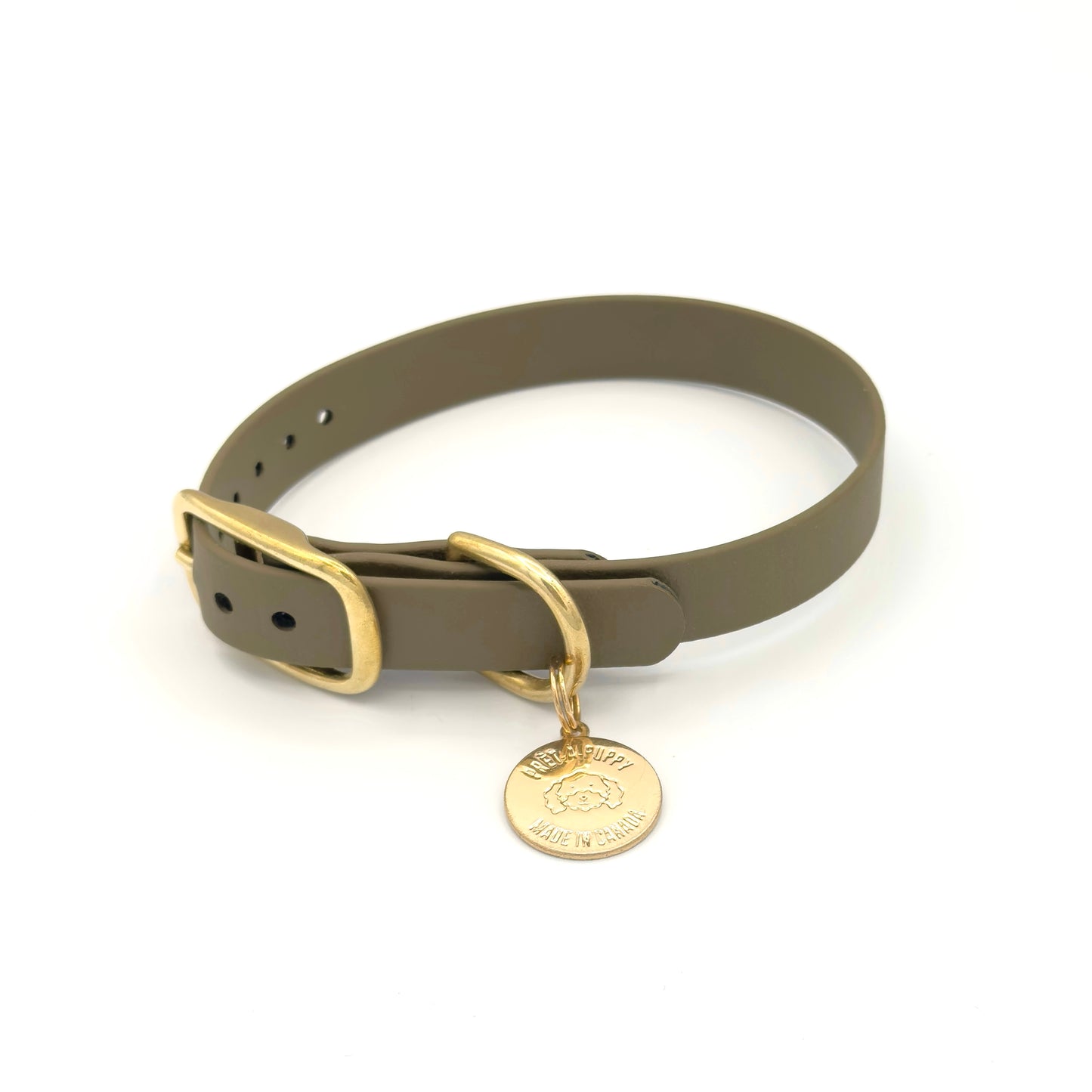 Stylish olive green dog collar made from high-quality vegan leather, featuring elegant gold hardware. This waterproof collar is soft to the touch, ensuring comfort for your pet while providing durability for everyday use. Ideal for pet owners looking for a fashionable, and long-lasting accessory for their dog.