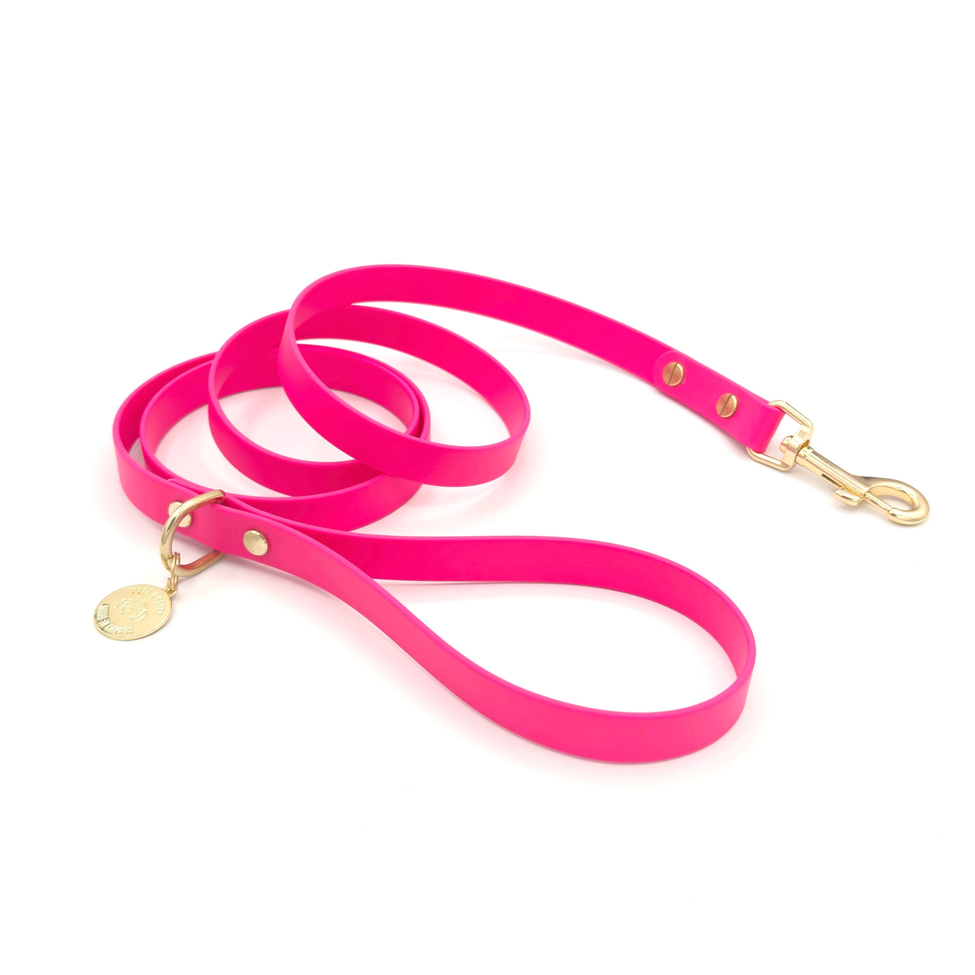 Stylish hot pink dog leash made from high-quality vegan leather, featuring elegant gold hardware. This waterproof leash is soft to the touch, ensuring comfort for pet owners while providing durability for everyday walks. Ideal for pet owners looking for a fashionable, and long-lasting accessory for their dog