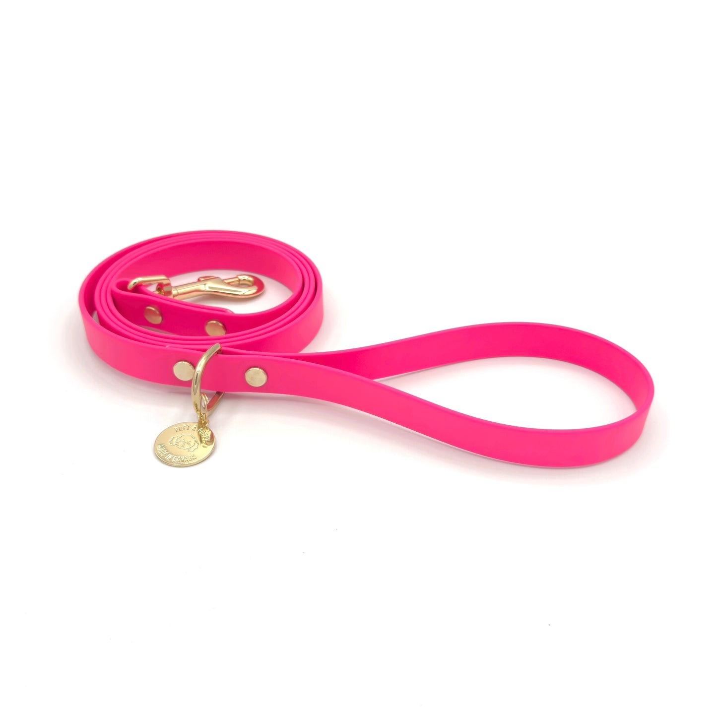 Stylish hot pink dog leash made from high-quality vegan leather, featuring elegant gold hardware. This waterproof leash is soft to the touch, ensuring comfort for pet owners while providing durability for everyday walks. Ideal for pet owners looking for a fashionable, and long-lasting accessory for their dog