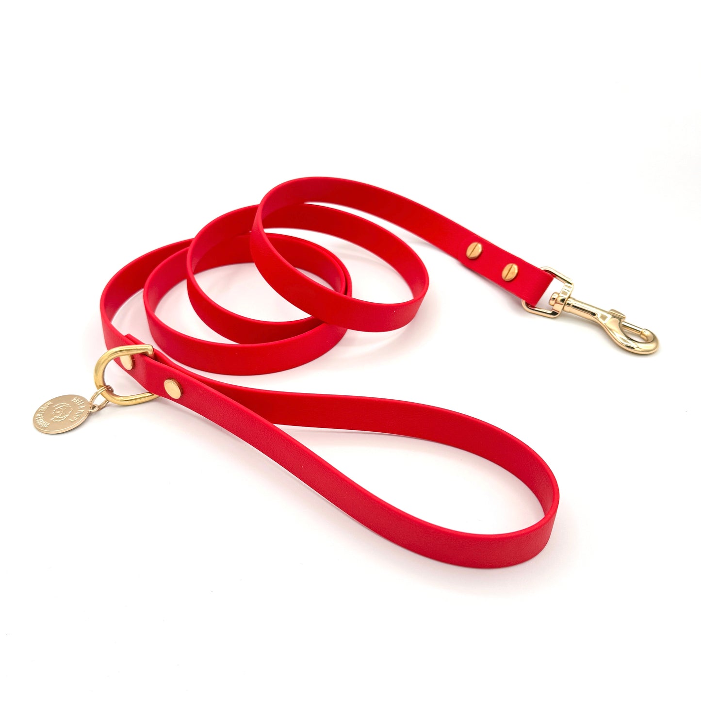 Stylish red dog leash made from high-quality vegan leather, featuring elegant gold hardware. This waterproof leash is soft to the touch, ensuring comfort for pet owners while providing durability for everyday walks. Ideal for pet owners looking for a fashionable, and long-lasting accessory for their dog