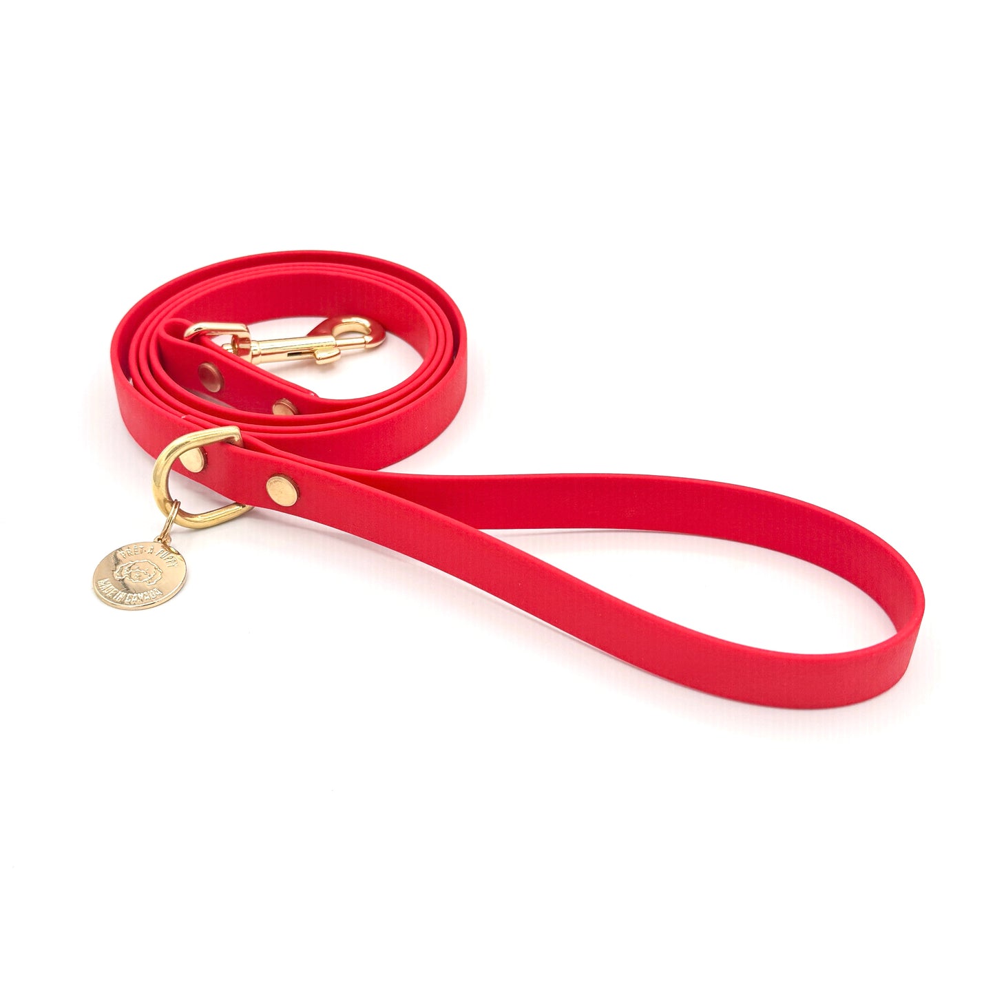 Stylish red dog leash made from high-quality vegan leather, featuring elegant gold hardware. This waterproof leash is soft to the touch, ensuring comfort for pet owners while providing durability for everyday walks. Ideal for pet owners looking for a fashionable, and long-lasting accessory for their dog