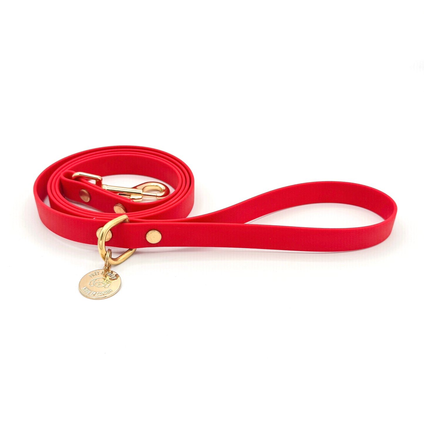 Stylish red dog leash made from high-quality vegan leather, featuring elegant gold hardware. This waterproof leash is soft to the touch, ensuring comfort for pet owners while providing durability for everyday walks. Ideal for pet owners looking for a fashionable, and long-lasting accessory for their dog