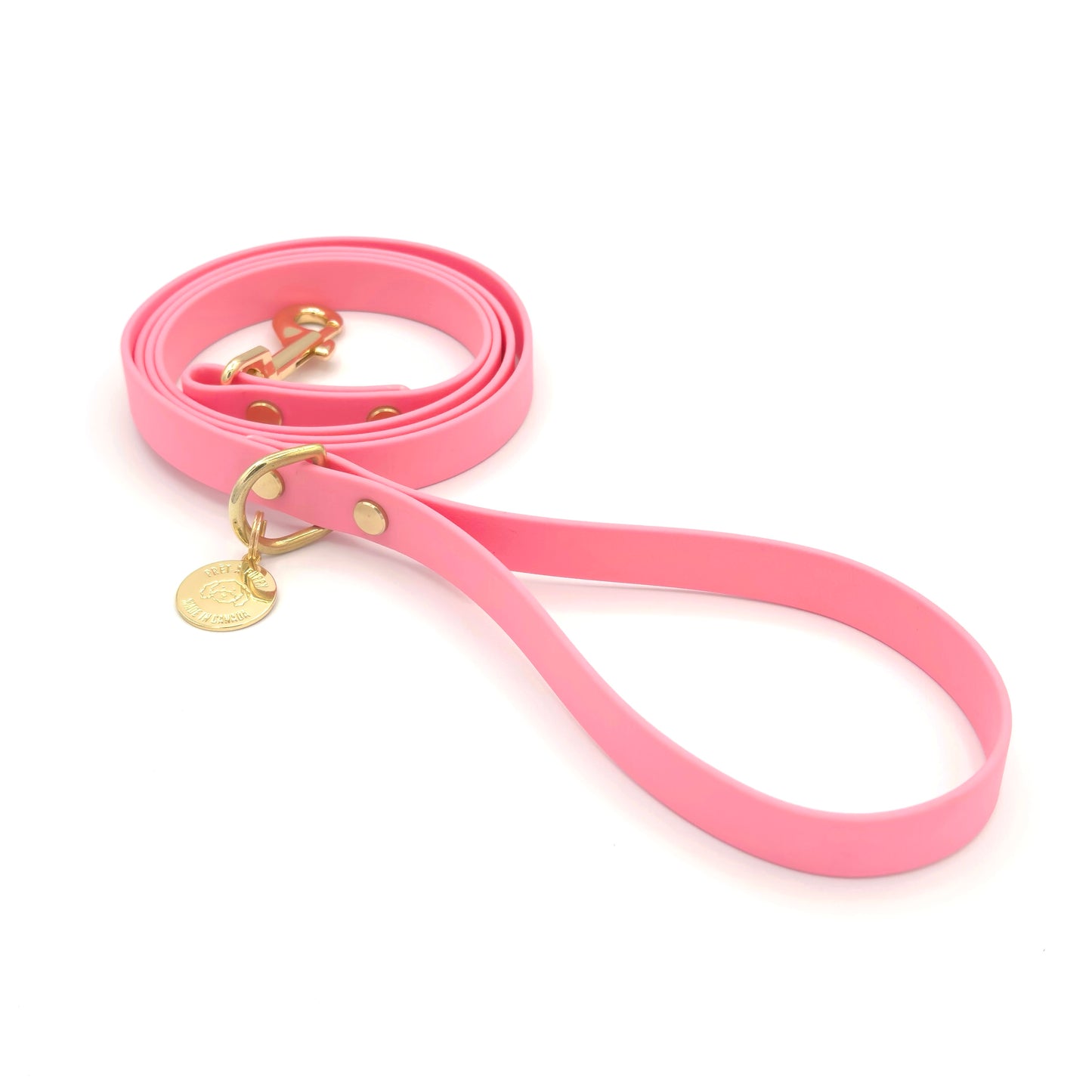 Stylish light pink dog leash made from high-quality vegan leather, featuring elegant gold hardware. This waterproof leash is soft to the touch, ensuring comfort for pet owners while providing durability for everyday walks. Ideal for pet owners looking for a fashionable, and long-lasting accessory for their dog