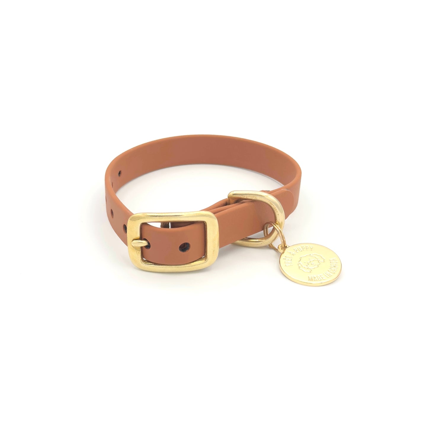 Stylish tan brown dog collar made from high-quality vegan leather, featuring elegant gold hardware. This waterproof collar is soft to the touch, ensuring comfort for your pet while providing durability for everyday use. Ideal for pet owners looking for a fashionable, and long-lasting accessory for their dog.