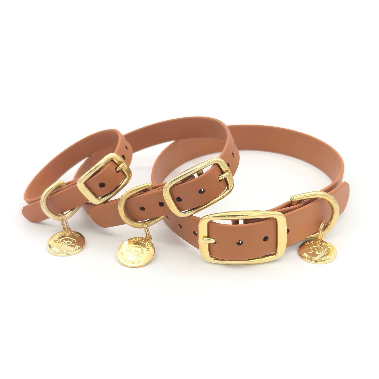 Stylish tan brown dog collar made from high-quality vegan leather, featuring elegant gold hardware. This waterproof collar is soft to the touch, ensuring comfort for your pet while providing durability for everyday use. Ideal for pet owners looking for a fashionable, and long-lasting accessory for their dog.