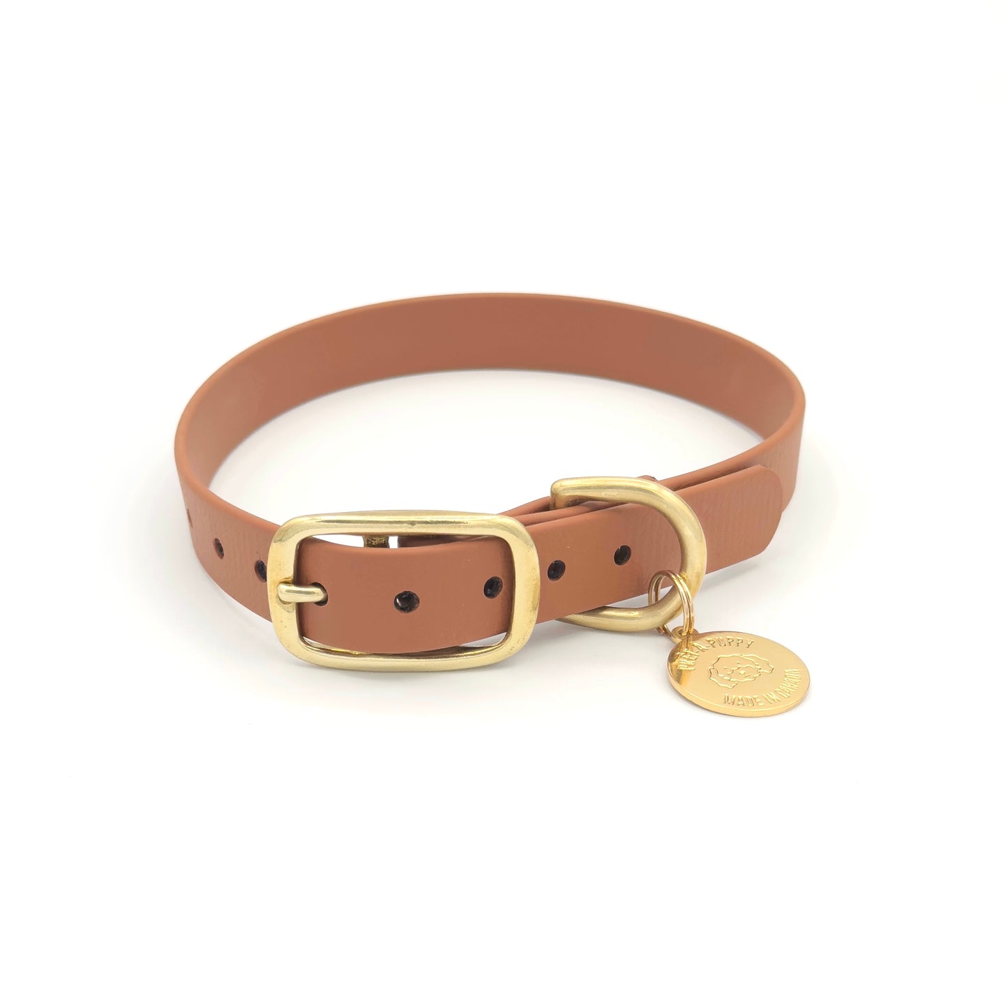 Stylish tan brown dog collar made from high-quality vegan leather, featuring elegant gold hardware. This waterproof collar is soft to the touch, ensuring comfort for your pet while providing durability for everyday use. Ideal for pet owners looking for a fashionable, and long-lasting accessory for their dog.