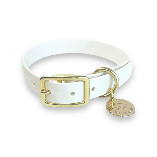 Stylish white dog collar made from high-quality vegan leather, featuring elegant gold hardware. This waterproof collar is soft to the touch, ensuring comfort for your pet while providing durability for everyday use. Ideal for pet owners looking for a fashionable, and long-lasting accessory for their dog.